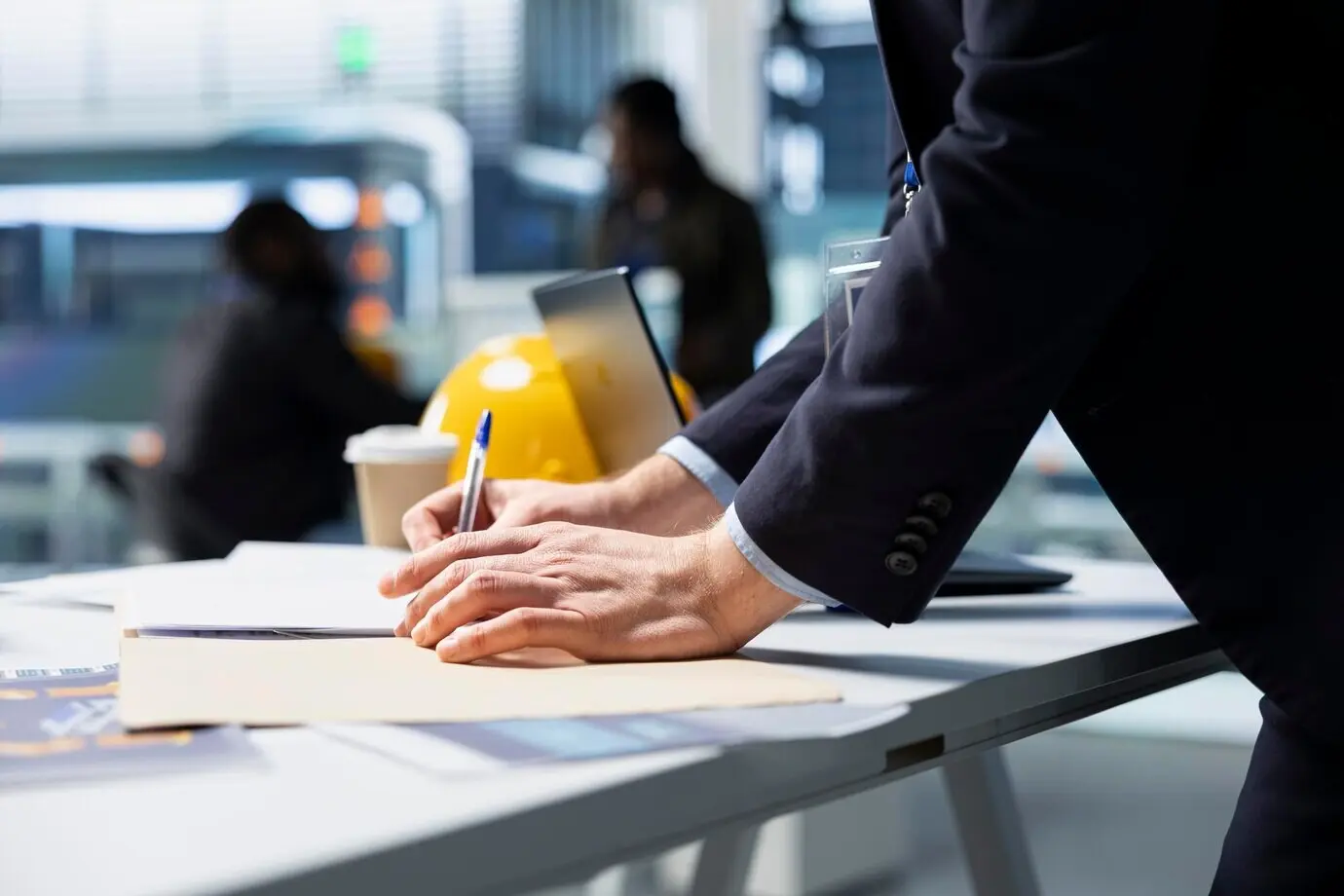 Building contractor supervising green technology in a high-tech facility
